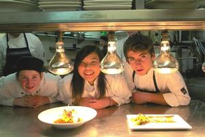 L-R Alice Ward, Haruka Arai, and Cassey Strachan practice their dishes ahead of finale dinner at Crowne Plaza Queenstown.